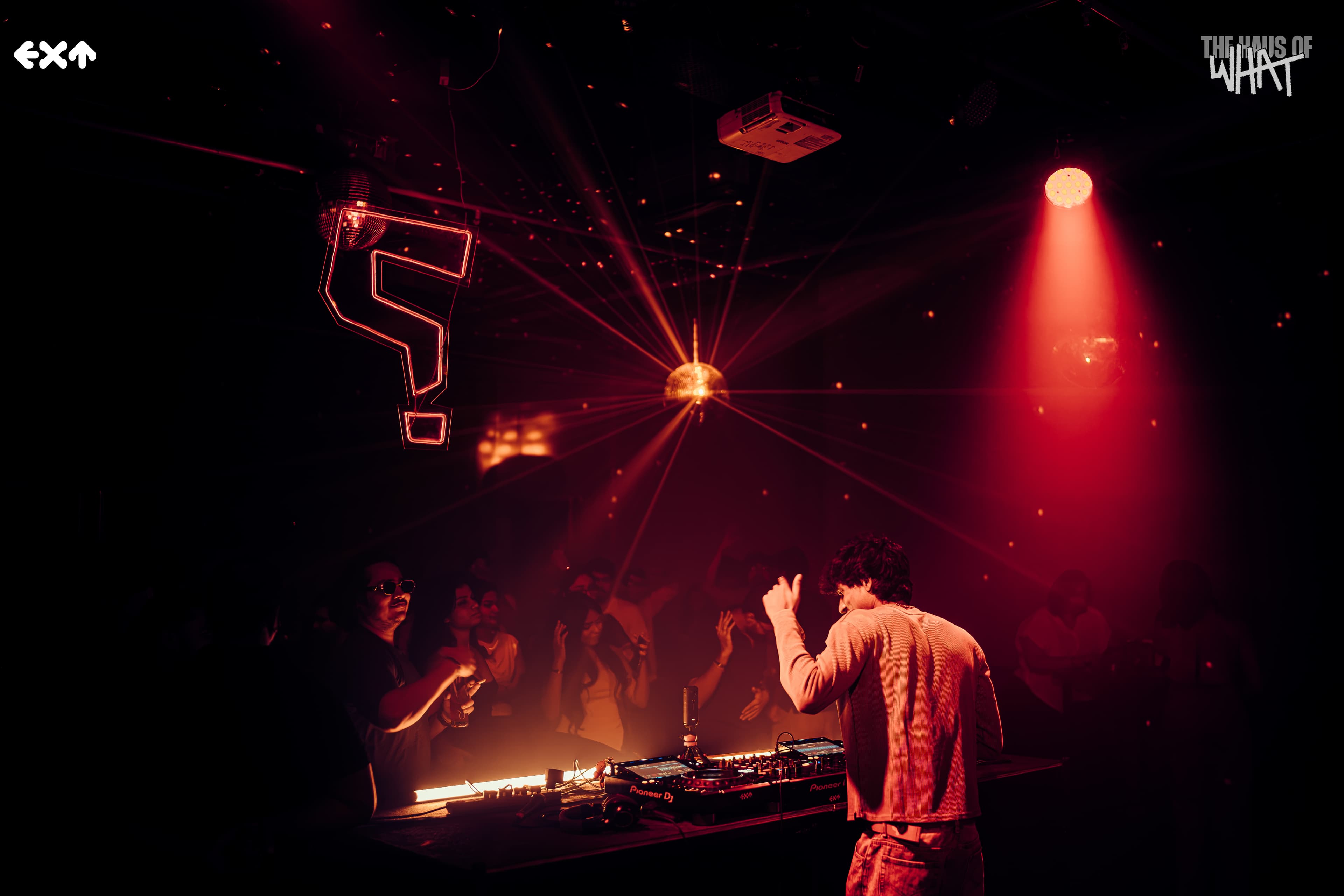 EXT SATURDAY NIGHT — HAUS OF WHAT